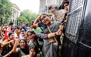 Activists of Socialist Unity Center of India protest against hike in rail fare, outside the governor's house in Kolkata.