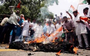 Congress supporters protest against the rail fare hike in Delhi