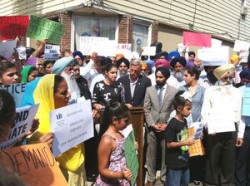 Sikhs rally at the corner where Sandeep Singh was hit by a driver in an alleged hate crime last week.