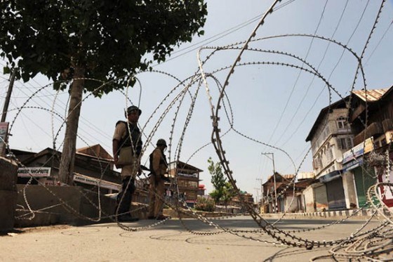Indian paramilitary soldiers stand guard during restrictions in downtown Srinagar on August 2, 2014. [File Photo]