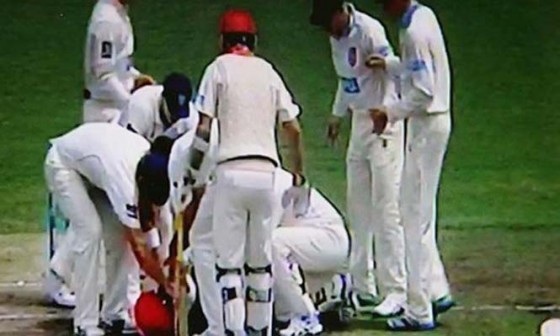 Players rush to help Phil Hughes after he was struck on the head in a Sheffield Shield match at the Sydney Cricket Ground