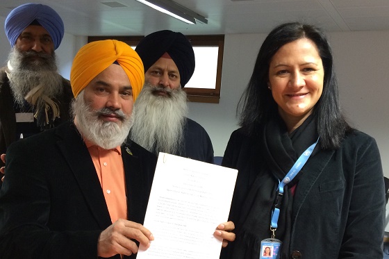 Prithpal Singh Switzerland with UN official submitting the copy of the memorandum