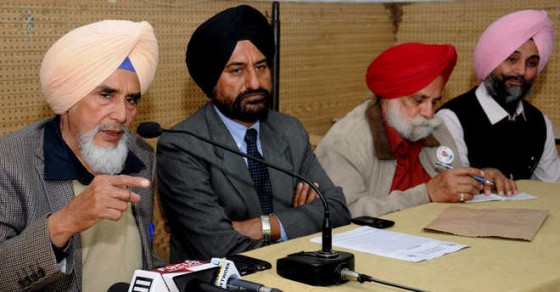 State convener of the Aam Aadmi Party Sucha Singh Chhotepur (left) addresses a press conference in Chandigarh on Feb 18