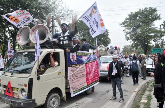 AAP activists take part in a roadshow in Mohali on Saturday