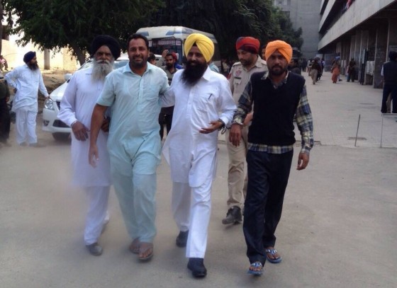 Ravinder Jit Singh Gogi in police custody [File Photo]