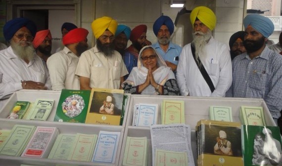 Bibi Inderjit Kaur with others at re-installed literature stall