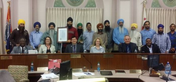 Sikh Community leaders pose with city Council of Stockon, CA after accepting 1984 Sikh Genocide Proclamation