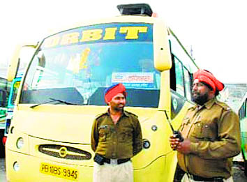 Policemen guarding a Orbit bus at Bathinda bus stand on March 07, 2008 [Source: The Tribune, March 08, 2008 Issue]