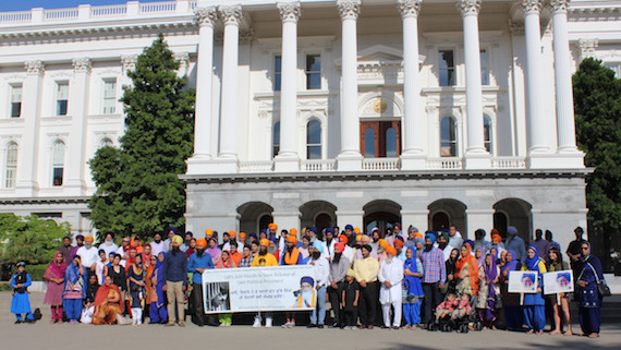 Supporters of Surat Singh Khalsa pose after the May 22 rally