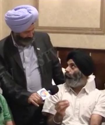 S. Balkaran Singh talking to a media person