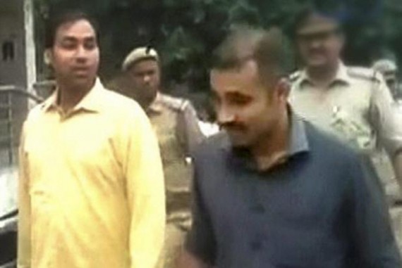 AAP MLA Manoj Kumar (L) after his arrest by Delhi police