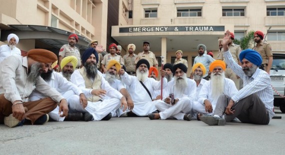 Activists of various Sikh organisations stage a protest outside a hospital in Ludhiana on Tuesday