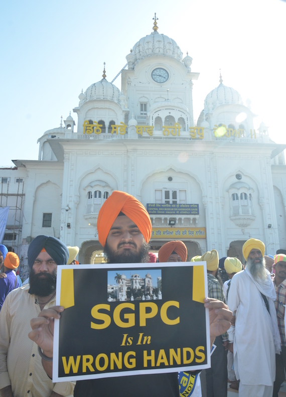 A Sikh youth activist holding a placard during the demonstration