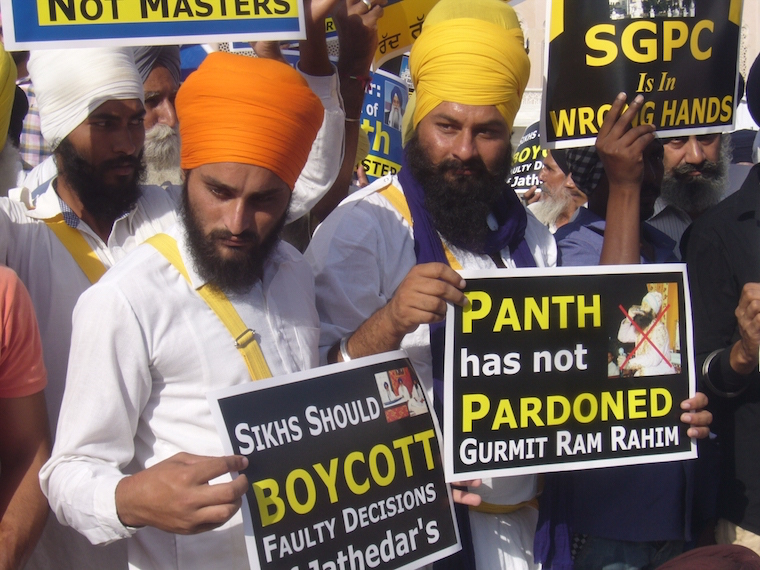 Sikh youth activists holding placards during the demonstration