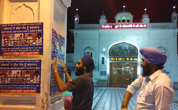 Sikh youth activists pasting posters calling to boycott Jathedars