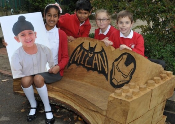 Maya Lall with photo of her brother Milan, and other pupils on the bench. Courtesy: Romford Recorder