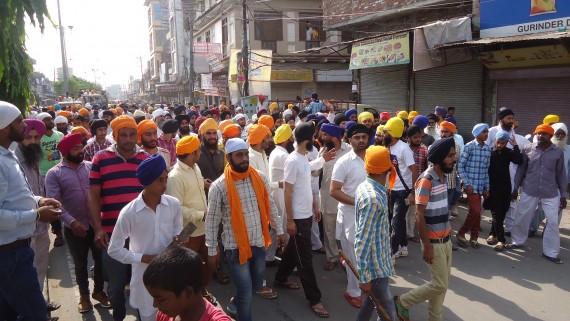Sikh youth marching on road at Tarn Taran