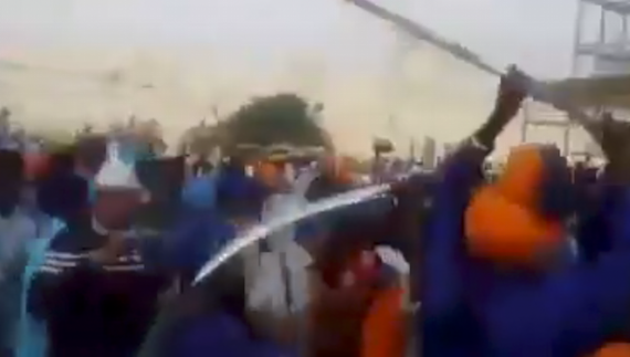A screenshot from a video of November 11, 2015 which shows people brandishing swords in front of Akal Takhat Sahib