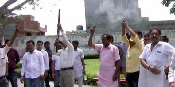 Shiv Sena leaders firing in the air during cremation of slain leader Durga Prasad Gupta as tribute in Khanna