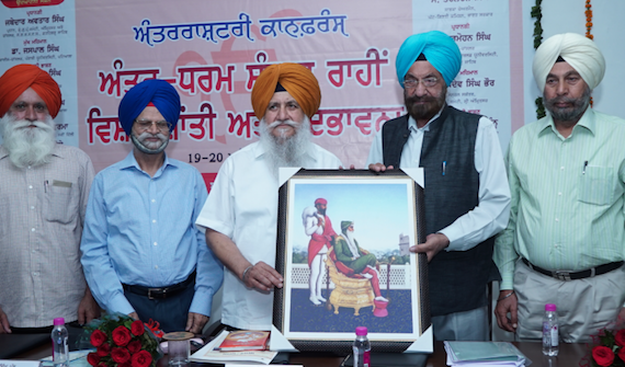 Vice Chancellor Dr Gurmohan Singh Walia, honouring  former Minority commission chairman S. Tarlochan Singh at the valedictory session of the conference