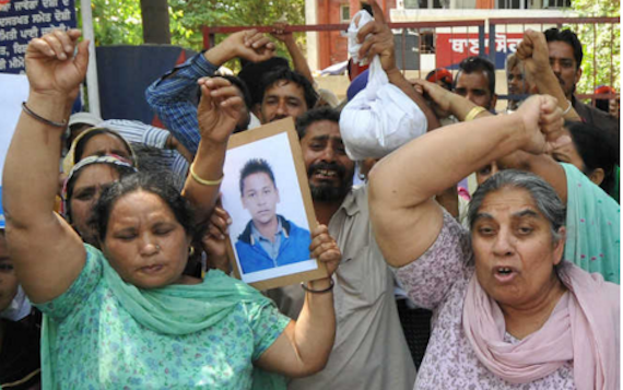 Jagdeep Singh’s mother (left), along with other family members and villagers, protest against the police outside the Sohana police station in Mohali on April 26