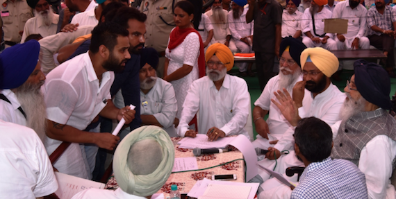 Parkash Singh Badal talks to people during a Sangat Darshan [File Photo]