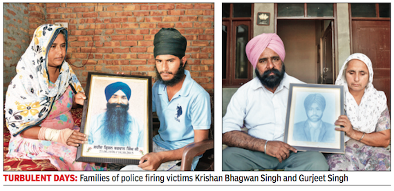 Family Mambers of Bhai Krishan Bhagwan Singh and Bhai Gurjeet Singh holding thier portraits | Photo - Times of India