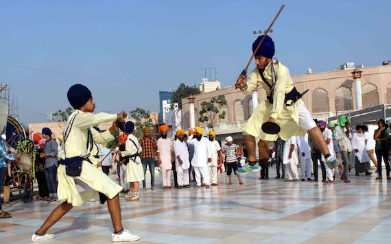 Sikh youth perform Gatka during the Nagar Kirtan | Photo: Sikh Siyasat News