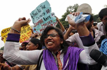 A demonstrator shouts slogans out side a court in New Delhi